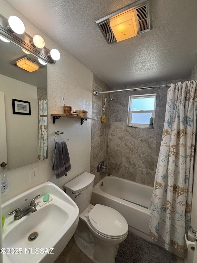 full bathroom with toilet, sink, shower / bath combo with shower curtain, and a textured ceiling