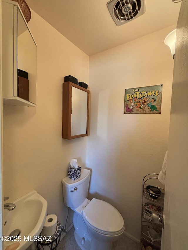 bathroom with toilet and sink