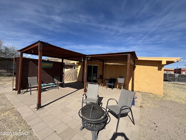 view of patio featuring a fire pit