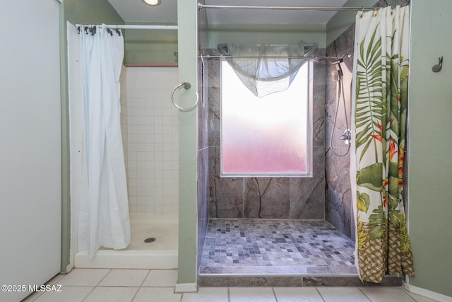 bathroom with curtained shower and tile patterned floors