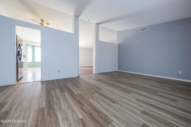 unfurnished room featuring hardwood / wood-style flooring and ceiling fan