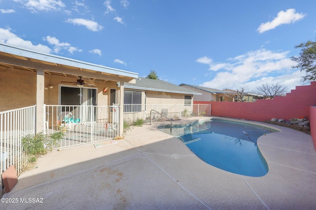 view of swimming pool featuring a patio and ceiling fan