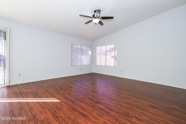 spare room featuring vaulted ceiling, wood-type flooring, and ceiling fan