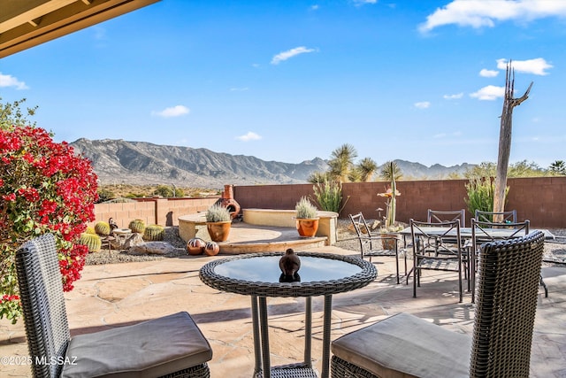 view of patio / terrace featuring a mountain view