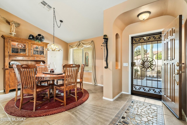 dining room featuring vaulted ceiling