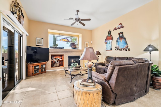 tiled living room with ceiling fan