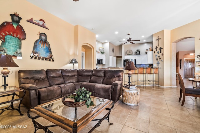 living room with light tile patterned floors and ceiling fan