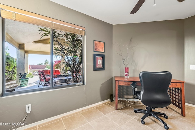 tiled home office featuring ceiling fan