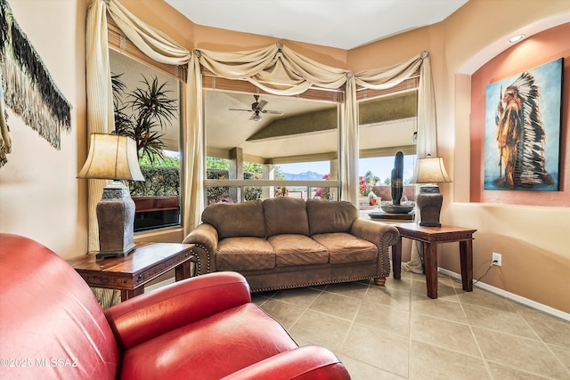 tiled living room with ceiling fan