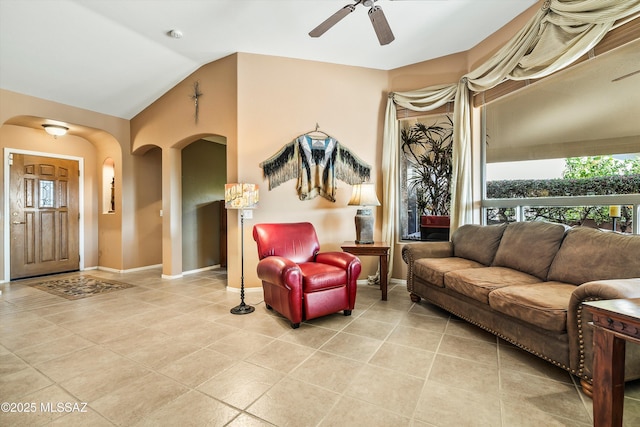 interior space with lofted ceiling and ceiling fan