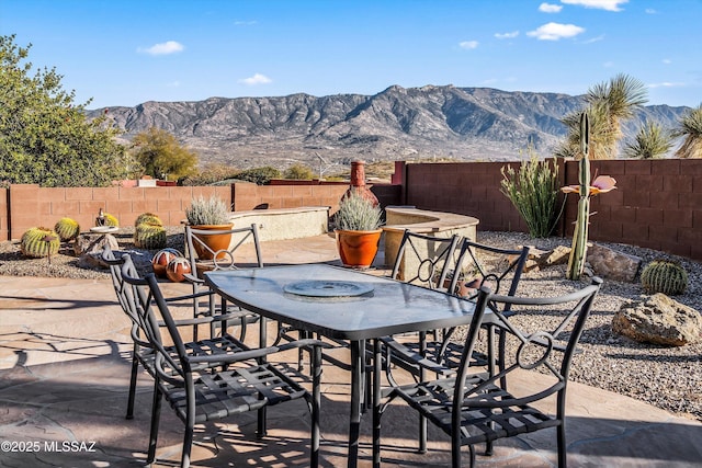 view of patio with a mountain view