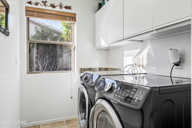 laundry area featuring cabinets and independent washer and dryer