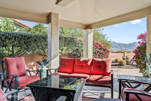 view of patio with a mountain view and an outdoor hangout area