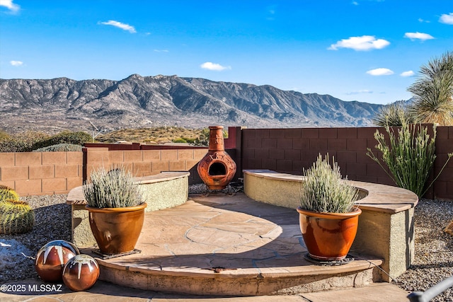 view of patio with a mountain view