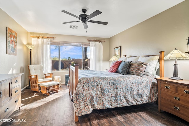 bedroom with ceiling fan and dark hardwood / wood-style floors