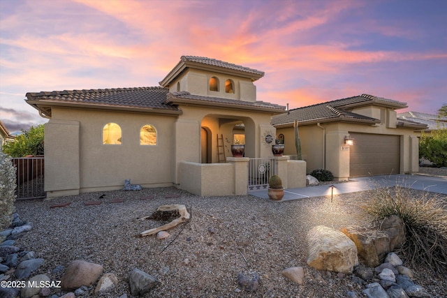 view of front of property with a garage