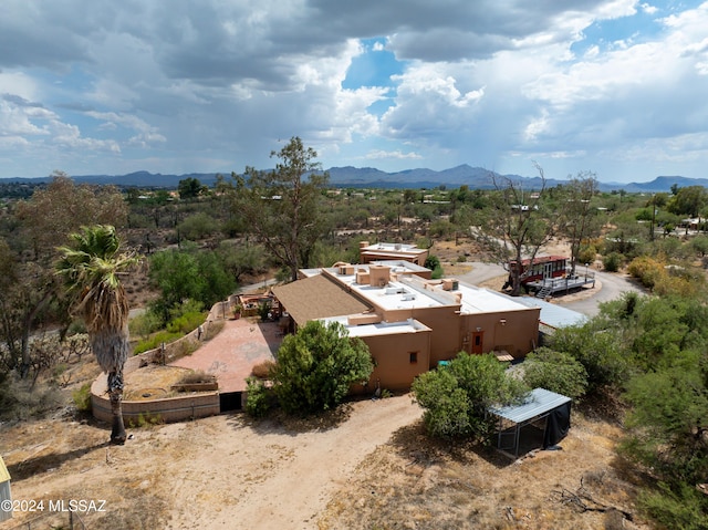 birds eye view of property featuring a mountain view