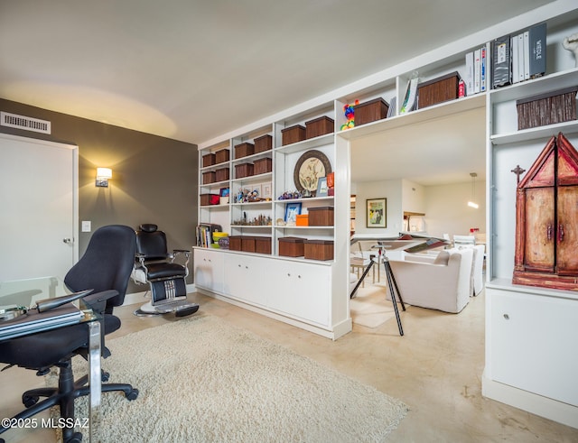 office space with concrete flooring