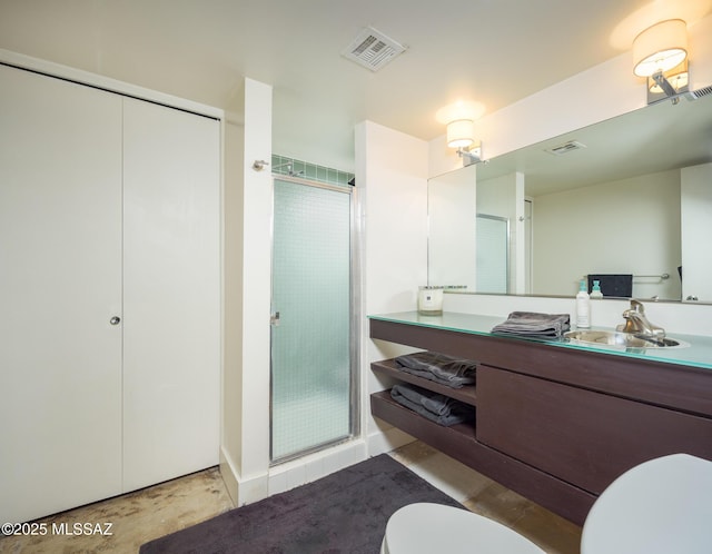 bathroom featuring vanity, toilet, and walk in shower