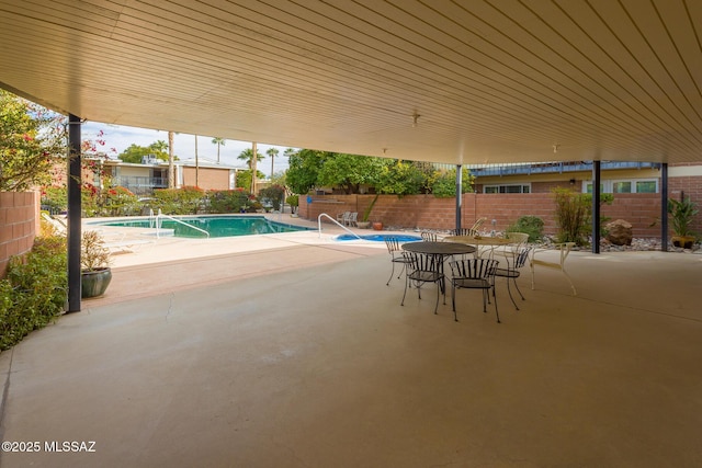 view of swimming pool featuring a patio area