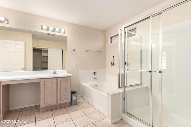 bathroom featuring vanity, separate shower and tub, and tile patterned floors