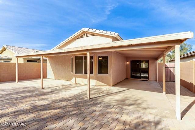 back of house featuring a patio area