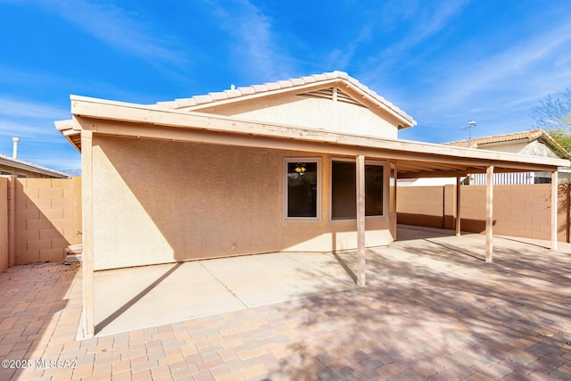 rear view of house with a patio area