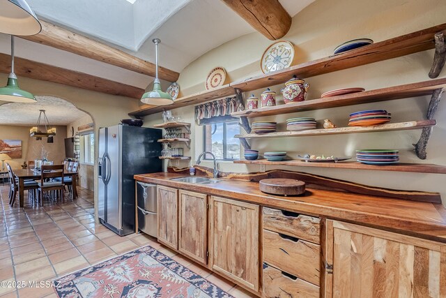 home office with light tile patterned floors and ceiling fan