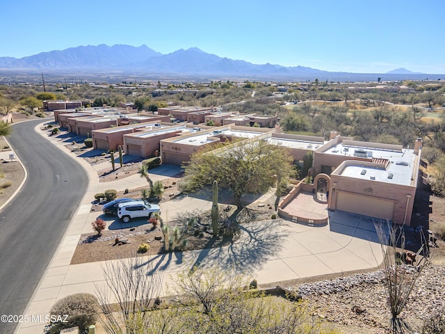 birds eye view of property with a mountain view