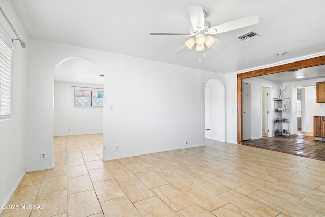 unfurnished room featuring light tile patterned floors, plenty of natural light, and ceiling fan