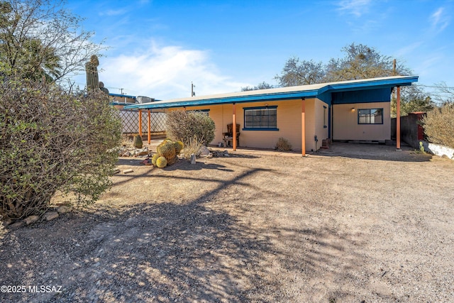 view of front facade with a carport