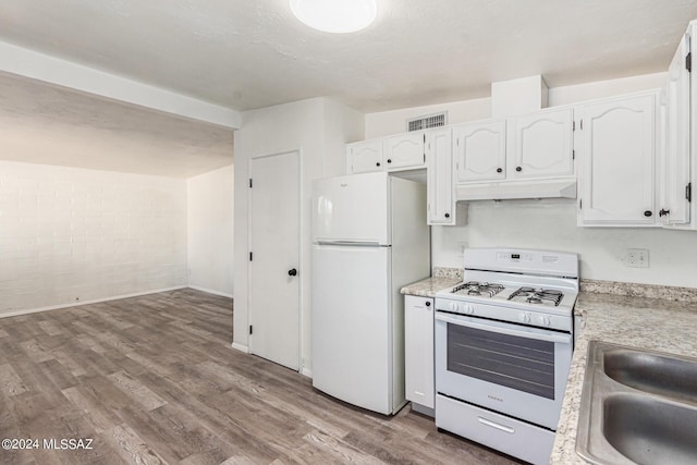 kitchen with sink, white cabinets, white appliances, and light hardwood / wood-style flooring