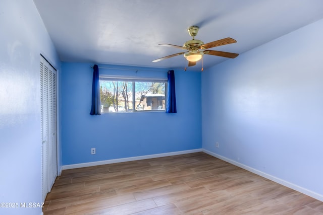 unfurnished bedroom featuring light hardwood / wood-style floors, a closet, and ceiling fan