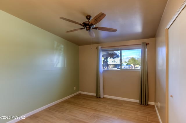 unfurnished room featuring ceiling fan and light hardwood / wood-style flooring