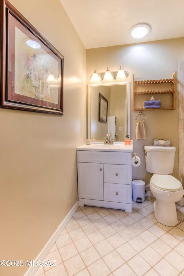 bathroom with tile patterned floors, toilet, and vanity