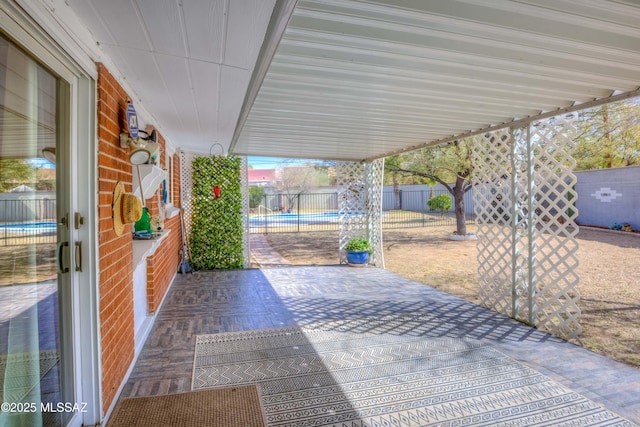 view of patio / terrace featuring a fenced in pool