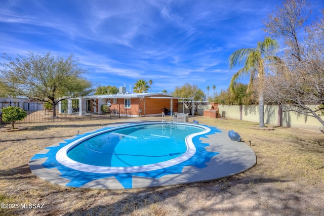 view of swimming pool with a patio area