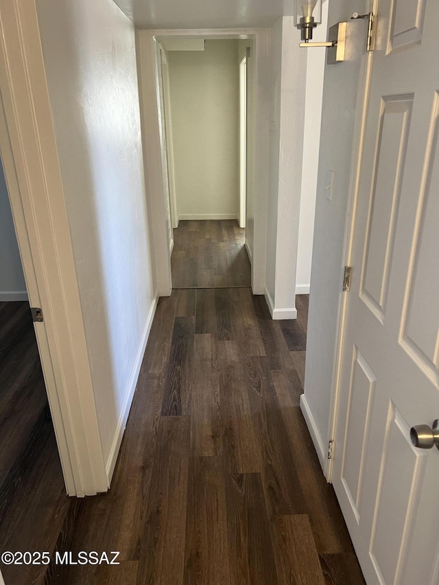 hall with dark hardwood / wood-style floors