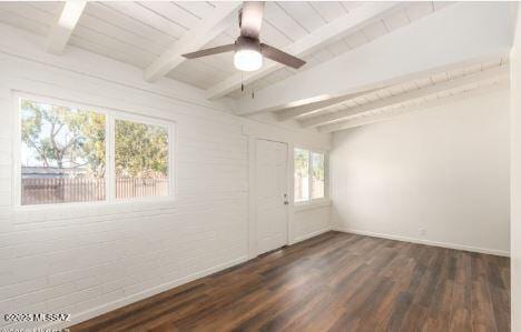 unfurnished room with beamed ceiling, ceiling fan, wood ceiling, and dark hardwood / wood-style flooring