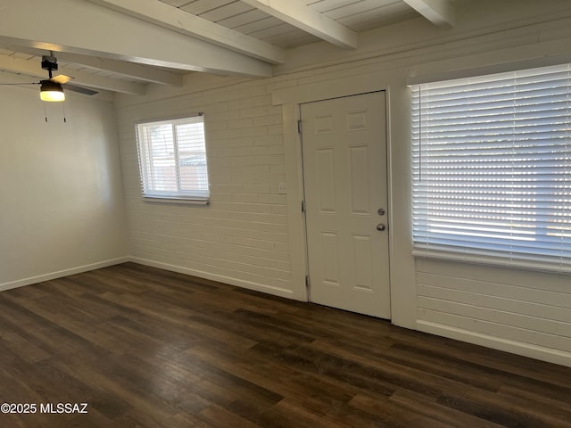 entryway with dark wood-type flooring, ceiling fan, and beamed ceiling