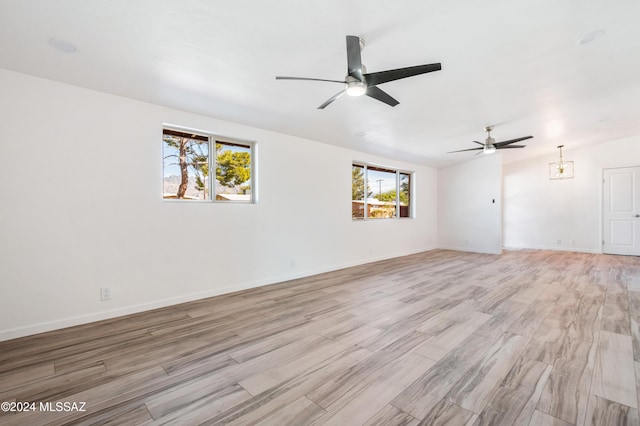 unfurnished room featuring ceiling fan and light hardwood / wood-style flooring