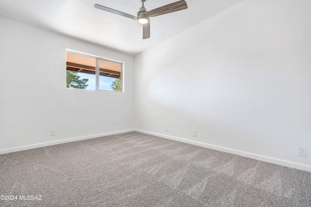 spare room featuring carpet flooring and ceiling fan