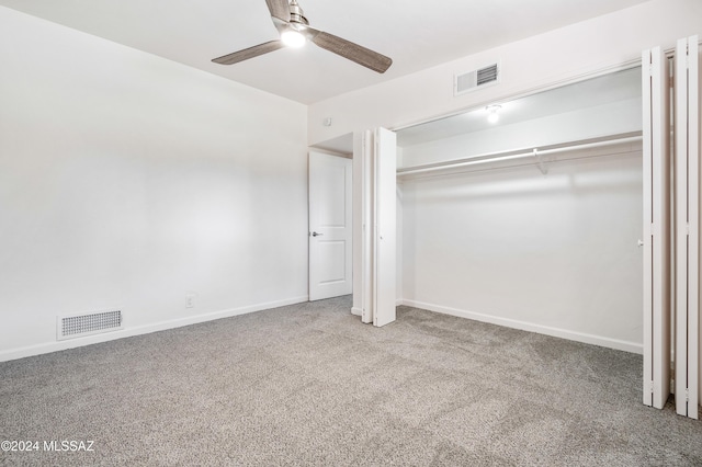 unfurnished bedroom featuring carpet floors, ceiling fan, and a closet