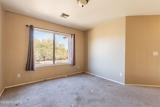 unfurnished room featuring light colored carpet