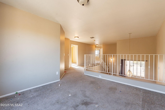 carpeted empty room with plenty of natural light