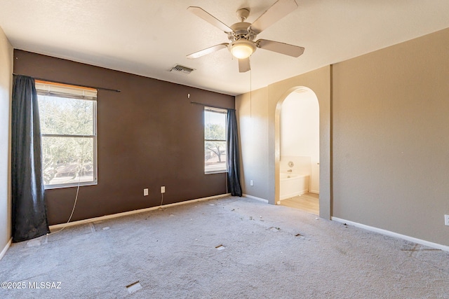 empty room featuring light carpet and ceiling fan