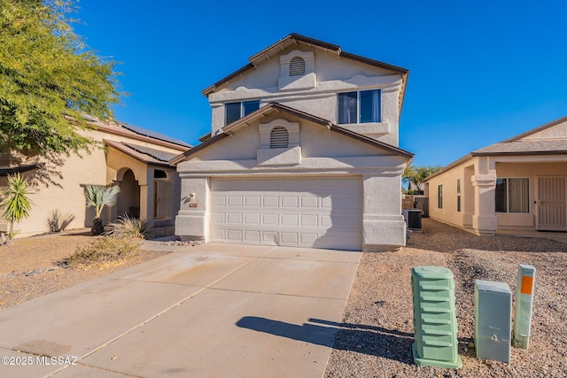 front of property with cooling unit and a garage