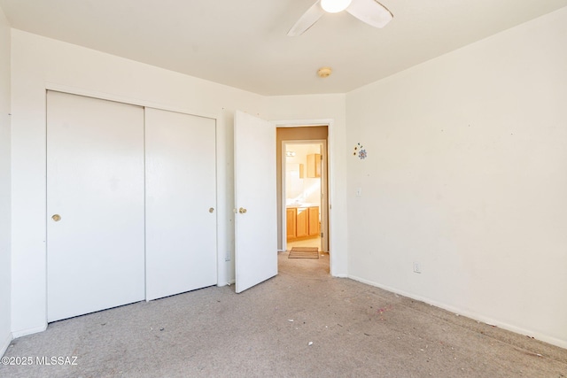 unfurnished bedroom featuring a closet and ceiling fan