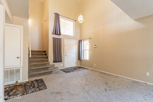 entrance foyer with a towering ceiling