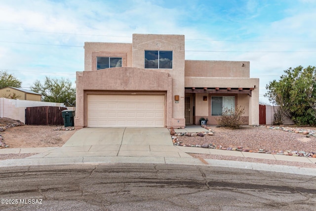 southwest-style home with a garage